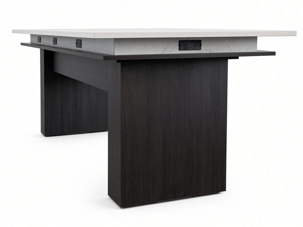 Conference table with dark espresso-finish panel base, white top and power and USB outlets built into the apron